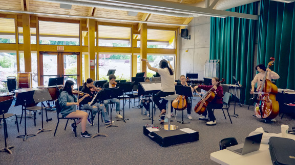 A group of students practicing in the music room