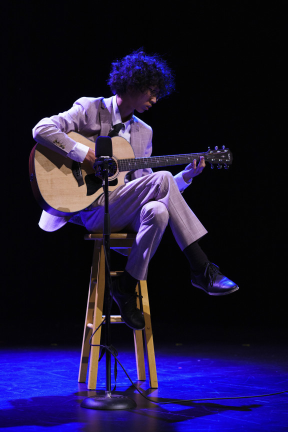 A guitar player playing solo