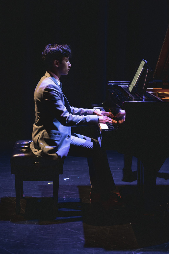 A piano player on stage
