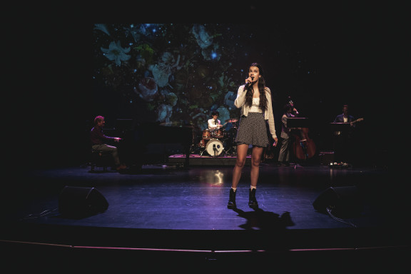 A singer performing in the theatre