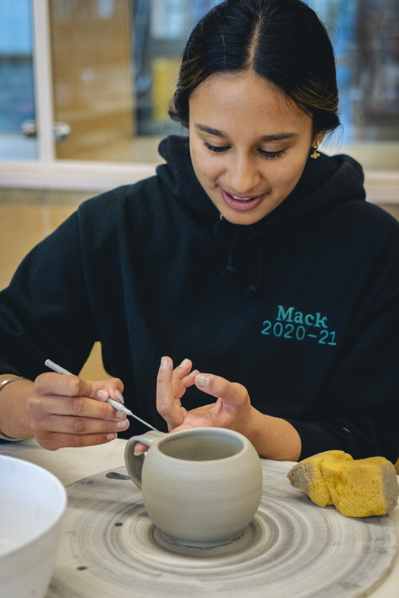 A student working on a new mug