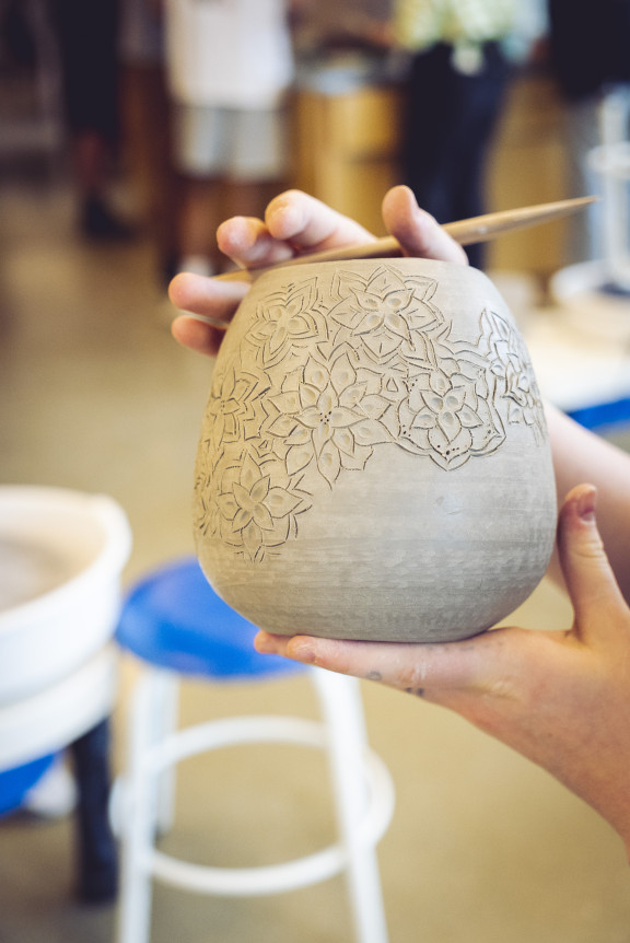 A pot with intricate details of flowers