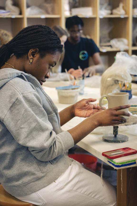 A student looks at a new cup