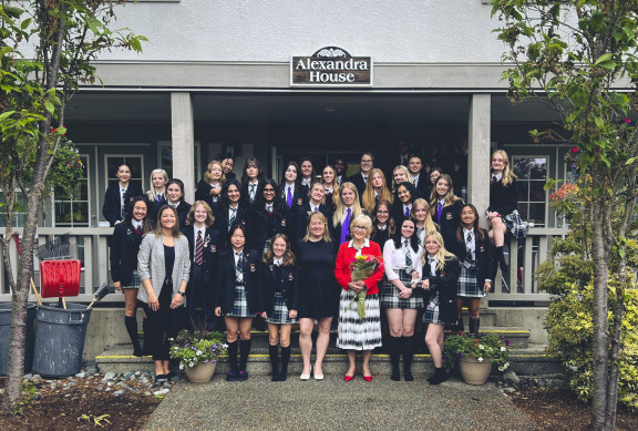 The boarding students of Alex House on the front steps