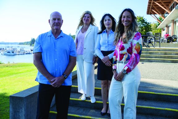 Admissions Team in front of Crooks Hall, where our students dine daily