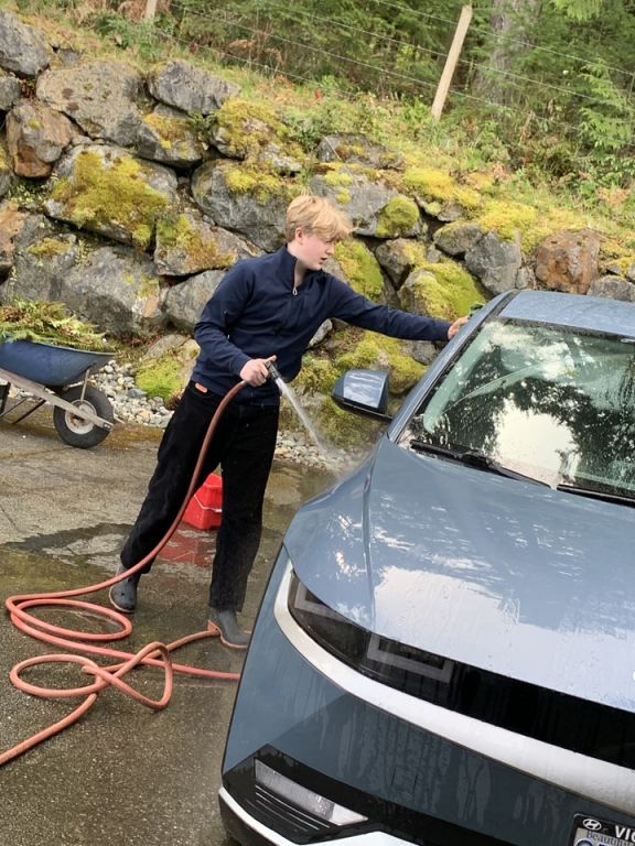 Brentwood student Caeden S washing cars on Service Day