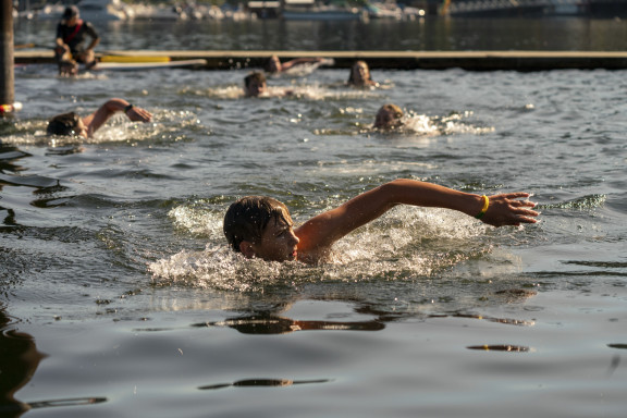 A student swimming in the ocean