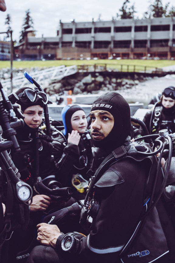 A group of students preparing to enter the water