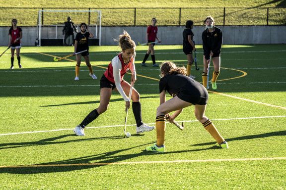 Field hockey players scrimmaging on the Brentwood turf