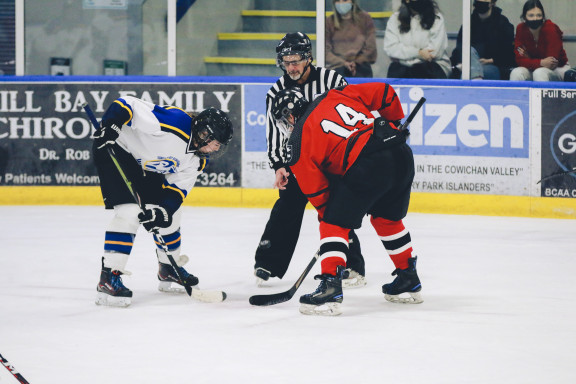 Two players getting ready for a faceoff