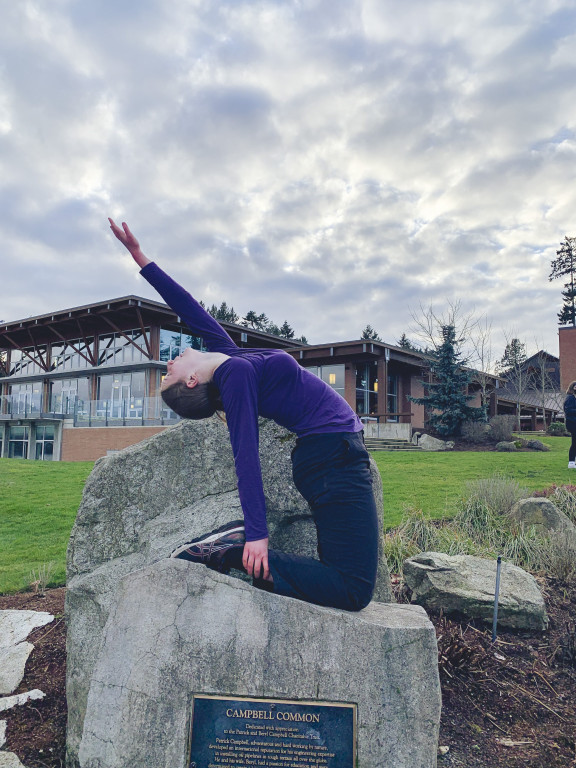 A yoga student practicing outside