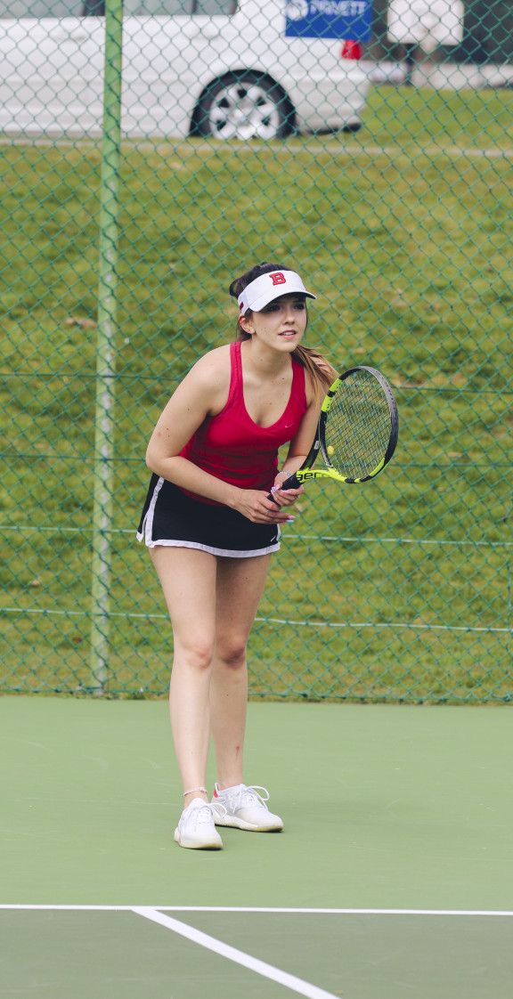 A tennis player preparing to receive the serve