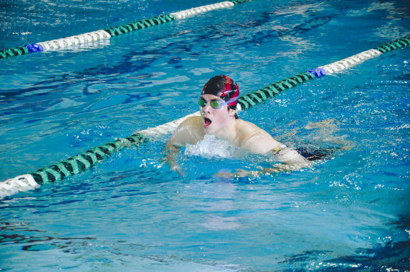 A student working on their technique in the pool