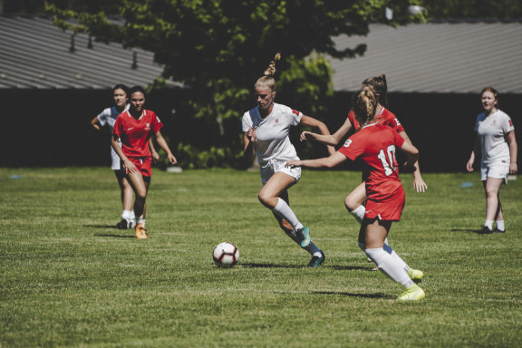 A player sprinting up the field