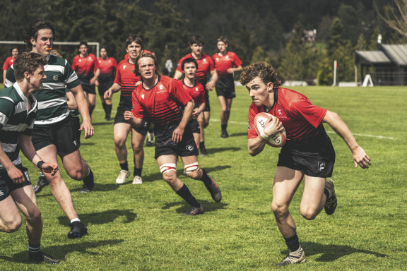 A rugby player running with the ball