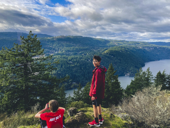 A student looking out over the Sannach Inlet after a run