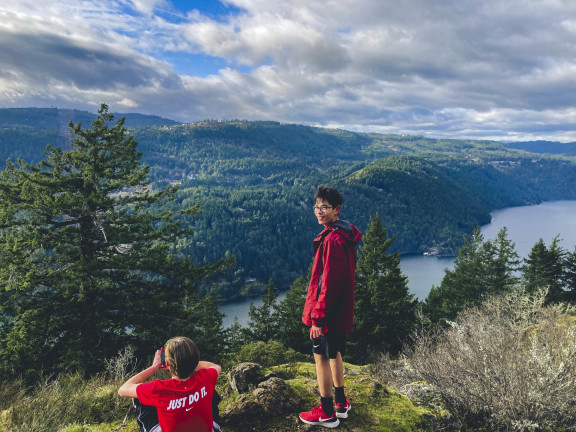 A student looking out over the Sannach Inlet after a run throughGowland Tod Provincial Park