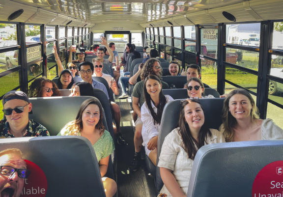 A bus full of alumni travel on a local tour
