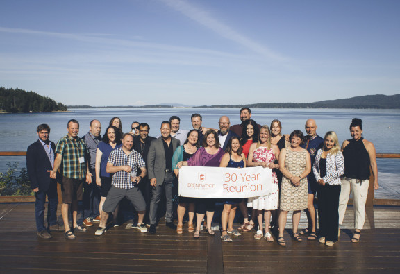 A grad class posing for their 30th reunion photo