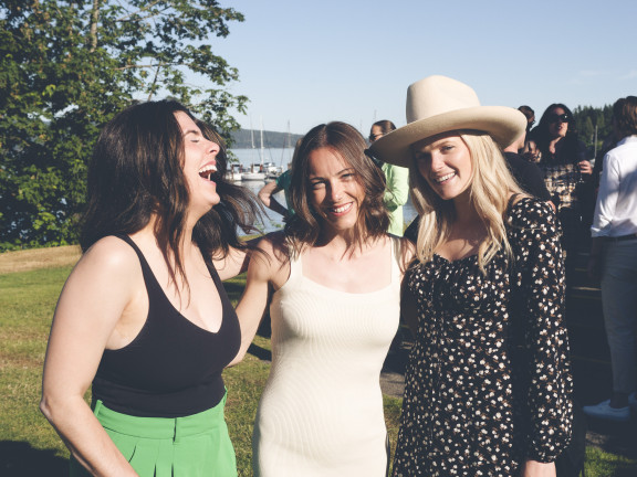 Alumni laughing during the annual summer reunion