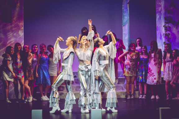 Students dressed in silver during the musical Mama Mia
