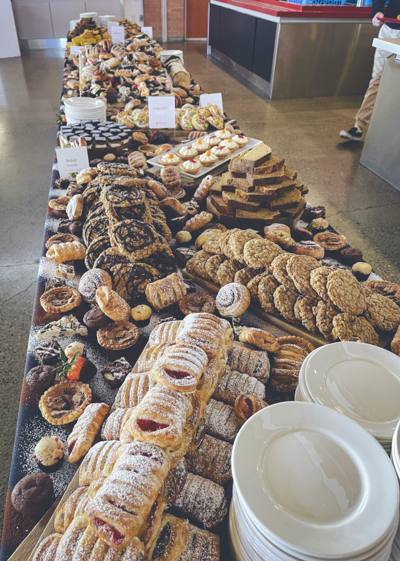 A table filled with baked goods at the weekly Brunch