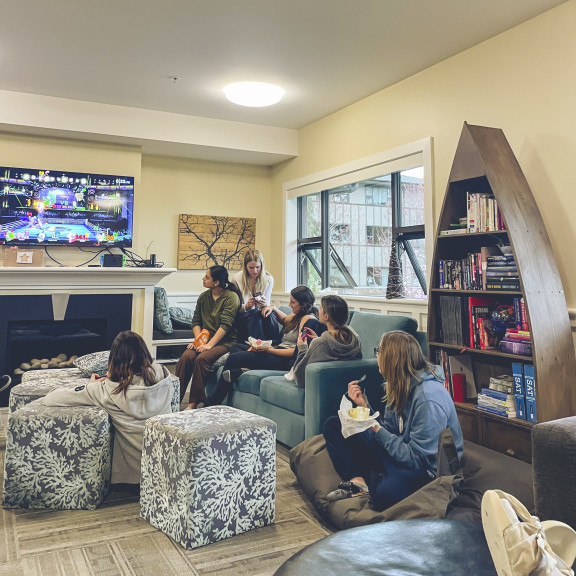 Private school students in common room playing video games