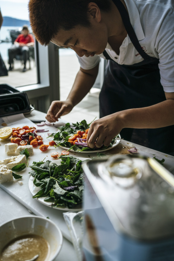 A student building a salad