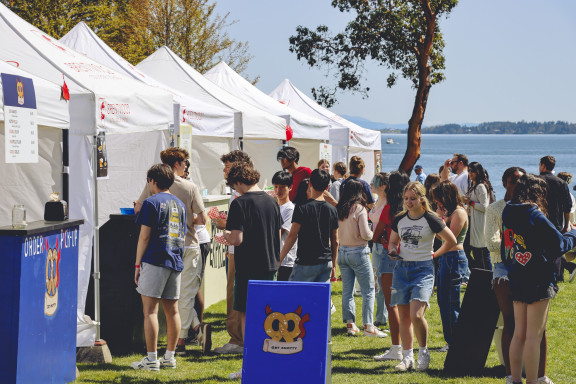 People waiting at tents to purchase food during the regatta