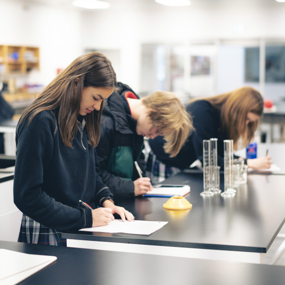 A group of students in the super lab working on an assignment