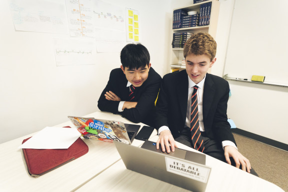 Two students working together in class