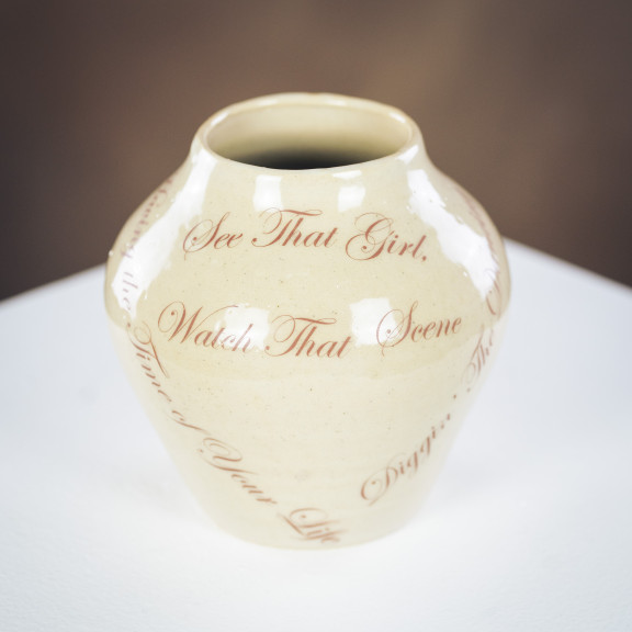 A pottery pot with lyrics