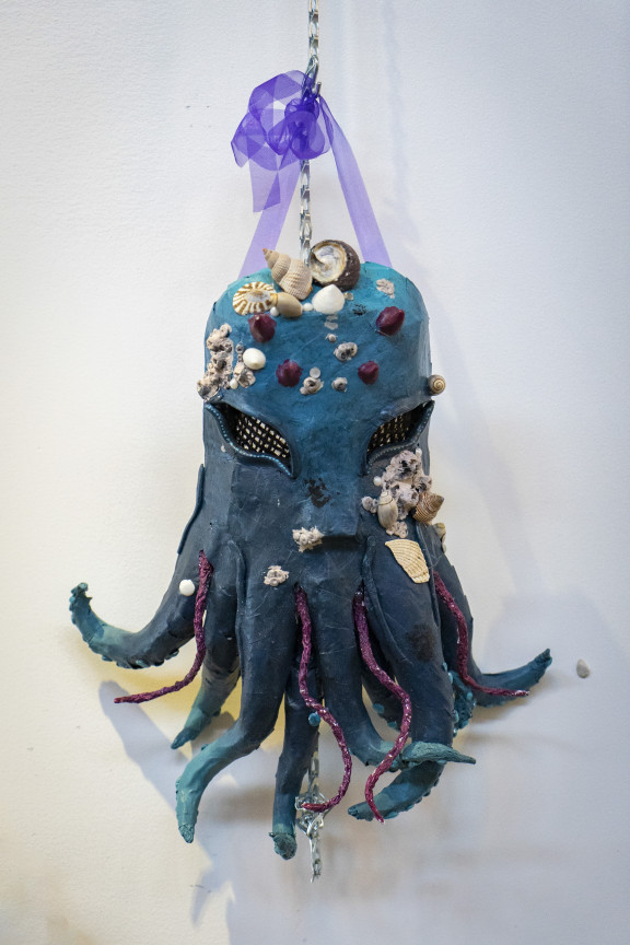 A sculpture mask in the shape of an octopus
