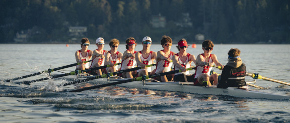 The men's 8+ rowing in an early morning race