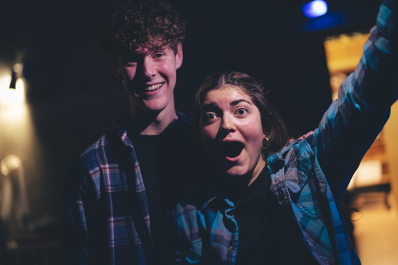 Two students backstage during a drama show