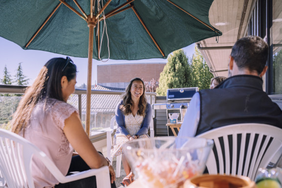 A house parent speaking with a new family