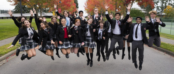 Students jumping in the air in a group