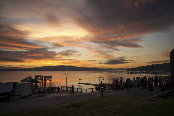 A sunrise with students at the waterfront