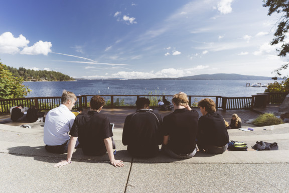 A private school teacher and students during an outdoor class