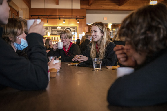 Boarding students smiling during a break in the Student Centre