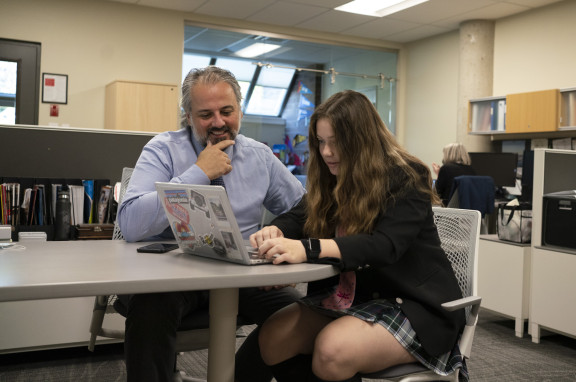 A university counsellor speaking with a student