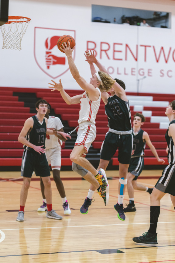 A basketball player shooting the basketball