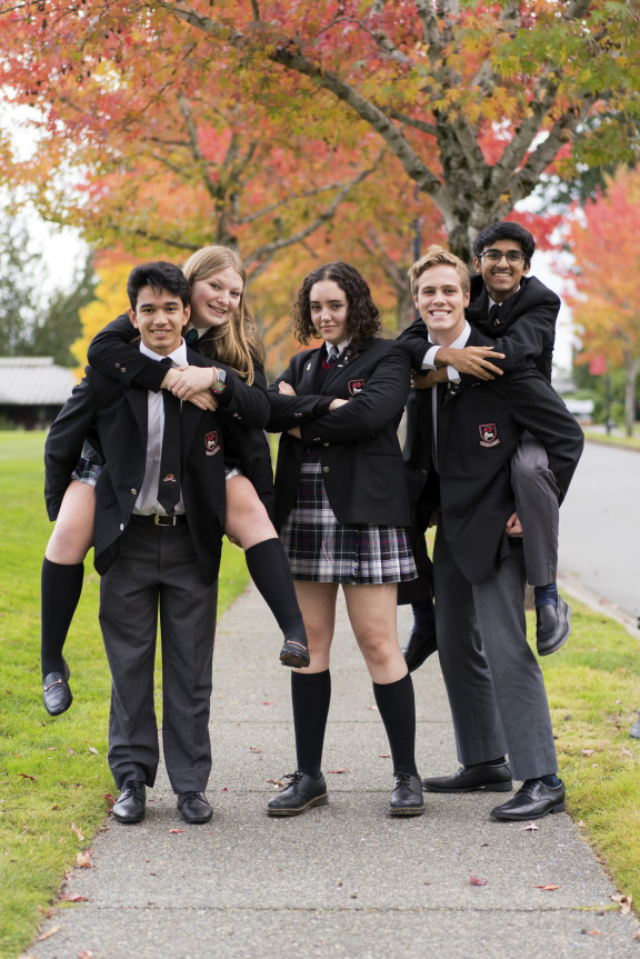 Smiling boarding students in uniform