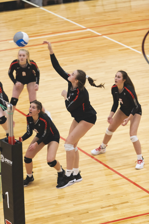 A volleyball player spiking the ball