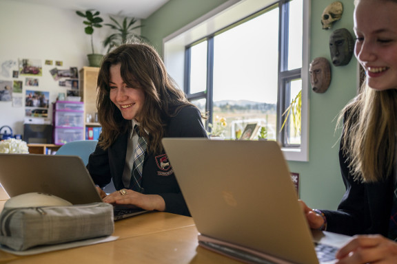 A smiling student in class