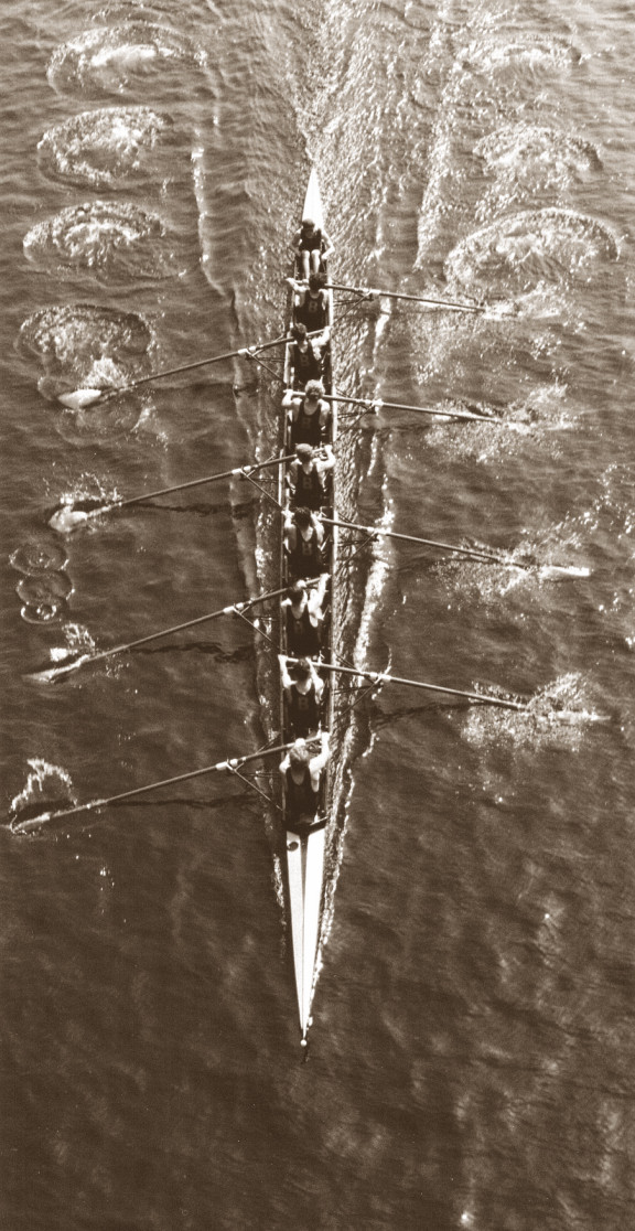 An older photo of a rowing 8 in the water