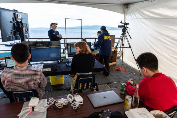 Officials and volunteers at the finish line tent