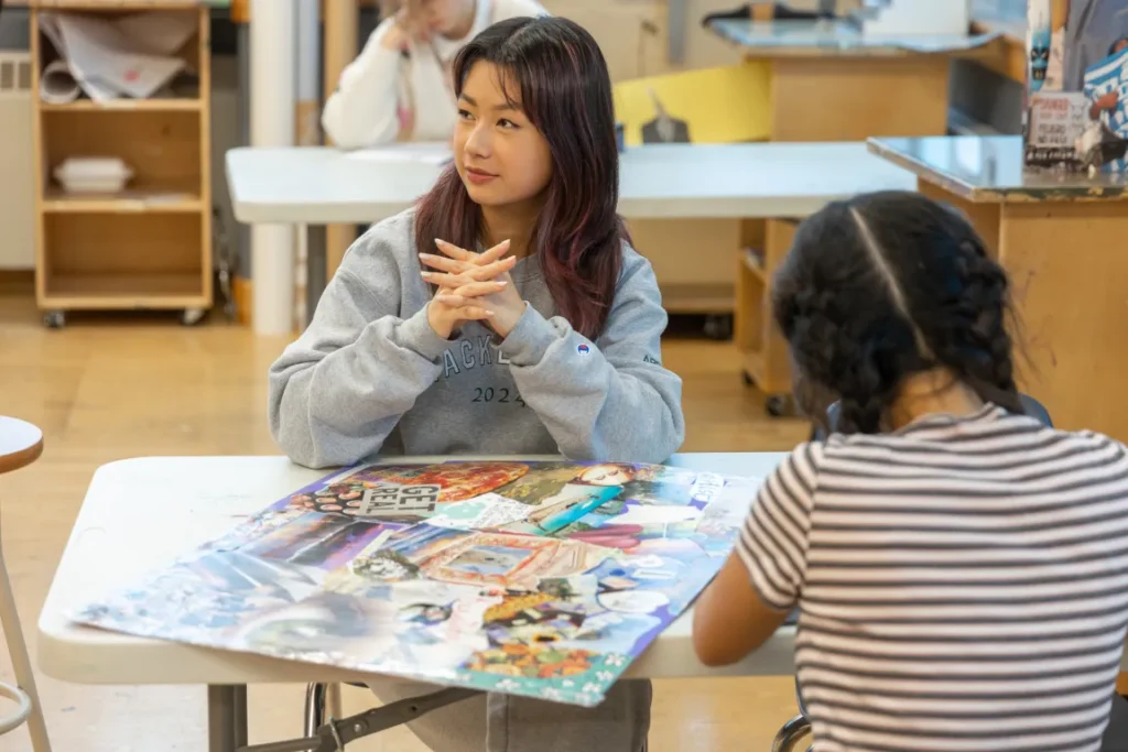 A student listens to her instructor