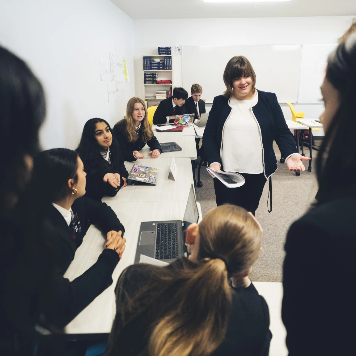 Private school academic teacher providing academic support to students