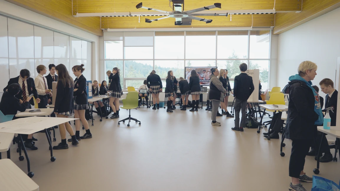Private school students exploring a group fair